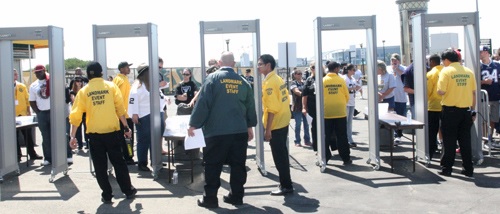 Three professional sports leagues (NFL, MLB and NHL) have mandated the use of walk-through metal detectors (also known as magnetometers) to enhance security at sports stadiums and arenas they oversee. Seen here are WTMDs in use by the Oakland Raiders. Photo credit: Oakland Raiders.